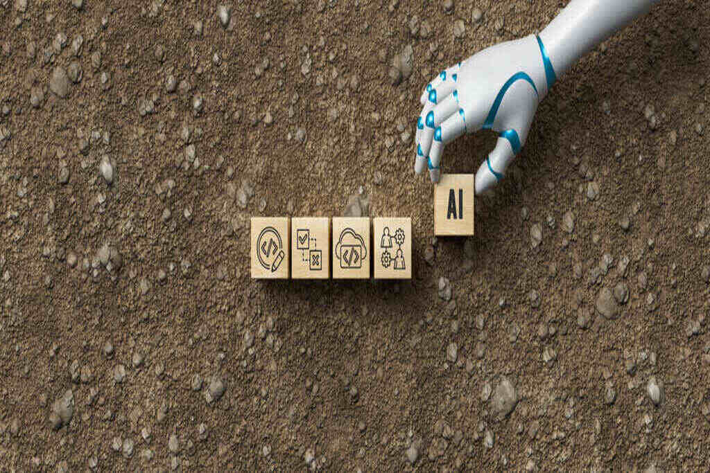 Mão de um robô colocando blocos com letras representando a importância do especialista em inteligência artificial
