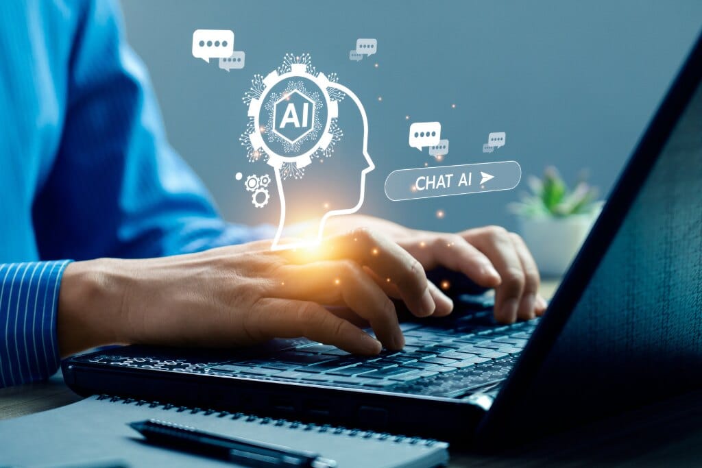 Pessoa utilizando inteligência artificial no notebook durante curso bubble para criação de aplicações e automações inteligentes modernas.